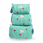 Three stacked makeup pouches in a tiered set, featuring a mint green and white striped pattern with small red hearts and blue tassels on the sides. Each pouch has a white label with the brand name 'TrendMarkets'.