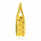 A yellow and white striped fabric tote bag with small red hearts printed vertically, shown against a plain white background.