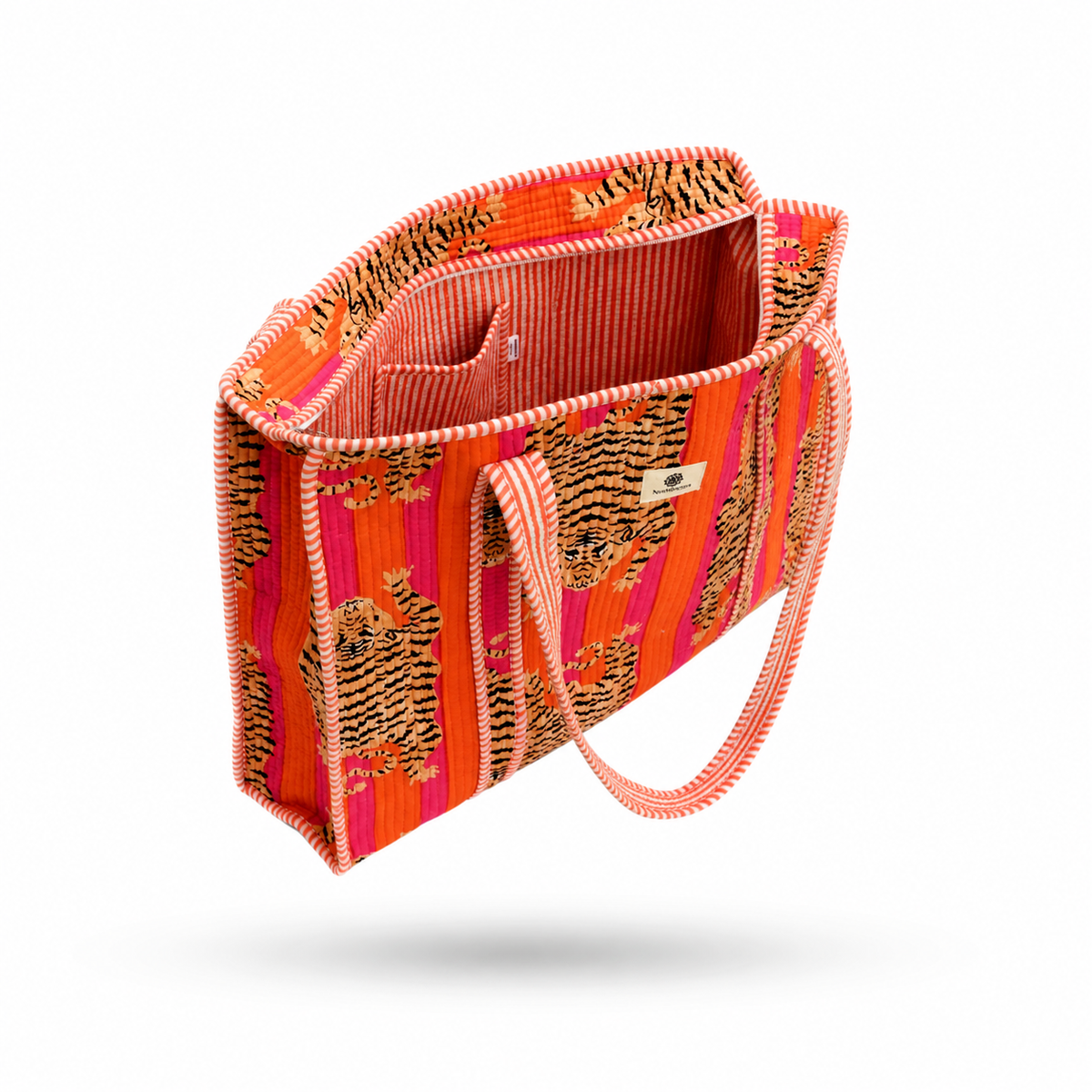 A vibrant orange and pink striped tote bag with tiger prints and a pink braided strap, shown floating against a white background.