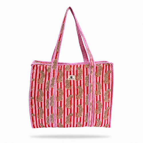 A pink and red striped tote bag with gold paisley patterns and pink-and-white braided shoulder straps, shown against a plain white background.