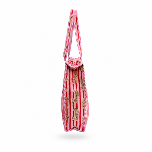 A red and white striped fabric tote bag with gold paisley patterns, shown from the side against a plain white background.