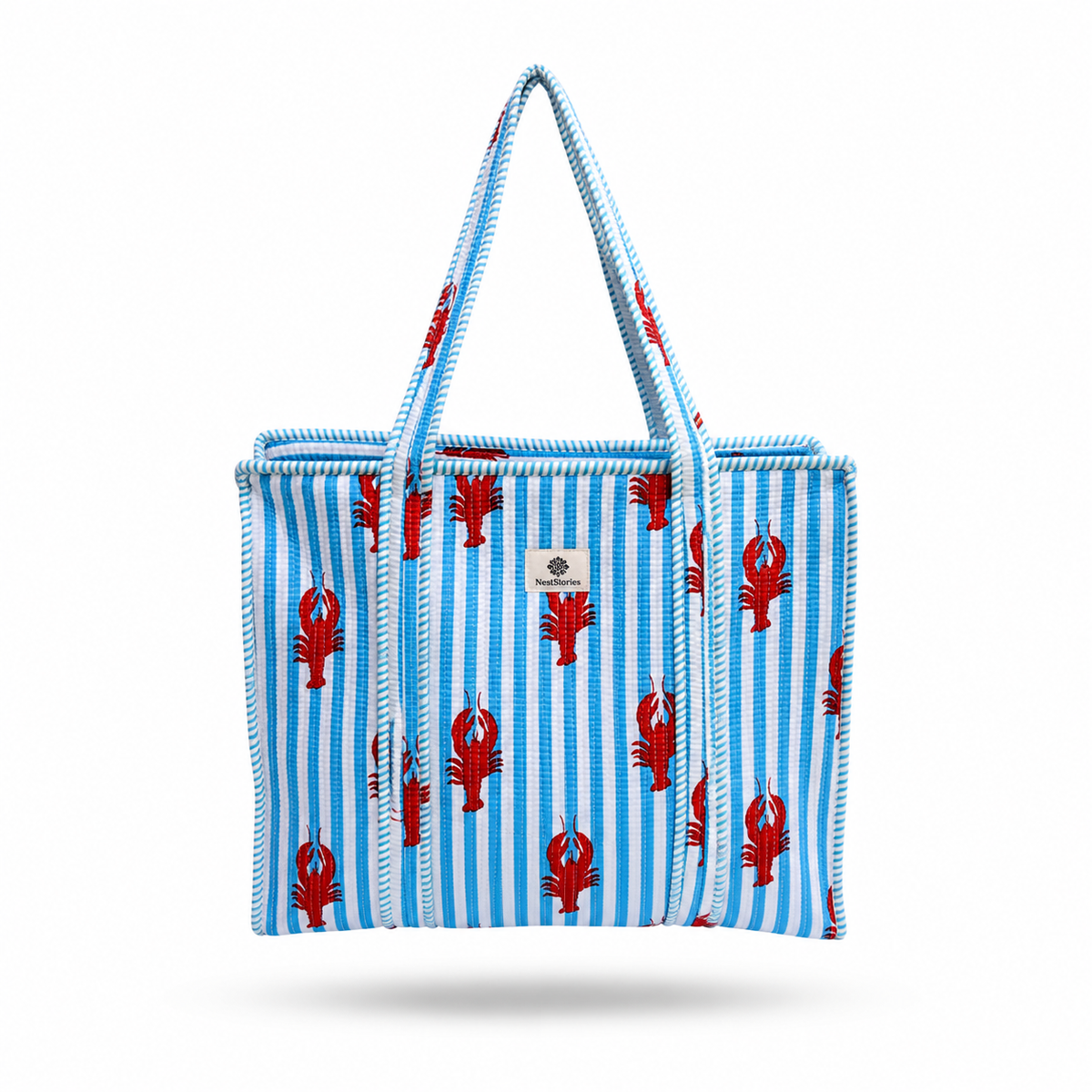 A striped tote bag with blue and white vertical stripes, red lobster motifs, and rope handles on a white background.