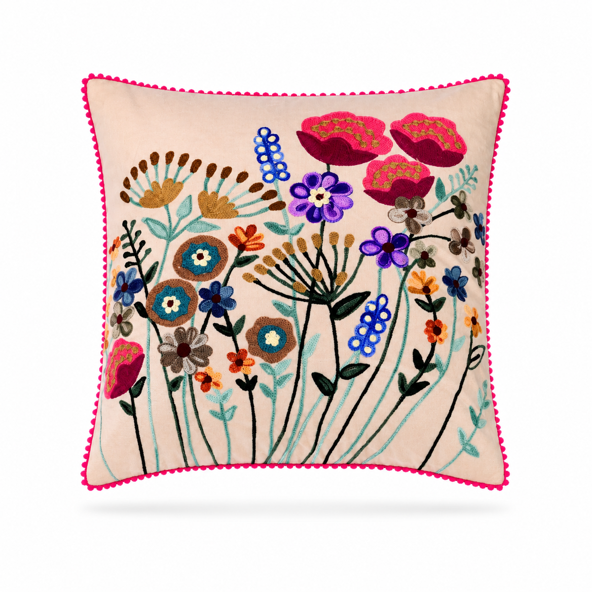 A square decorative throw pillow with a vibrant floral embroidery design on a light beige background, finished with a bright pink pom-pom trim, shown against a plain white background.
