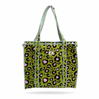 A woven tote bag featuring a green, black, and pink leopard print pattern with striped green and black handles, shown against a plain white background.