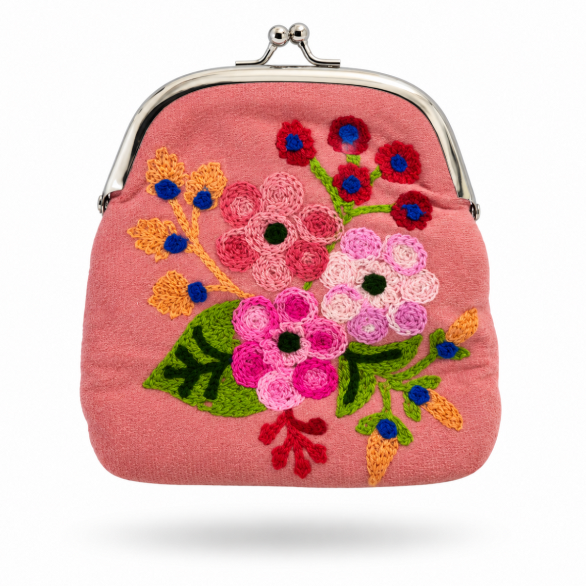 A pink fabric kiss-lock clutch purse featuring a colorful, hand-embroidered floral pattern with green leaves, pink and white flowers, and red and blue accents, set against a plain white background.