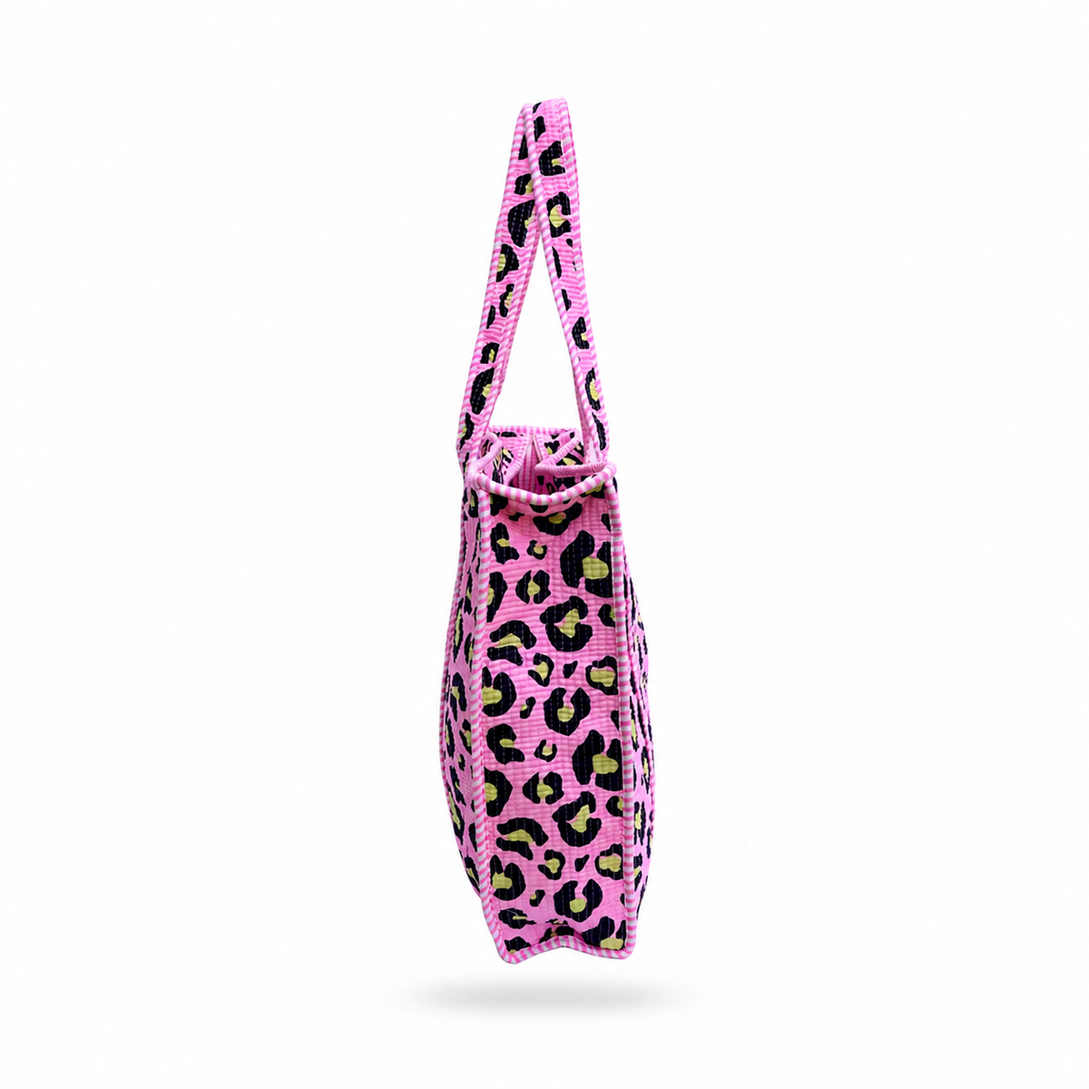 A pink woven tote bag with a black and lime green leopard print pattern, shown from a side profile view against a white background.