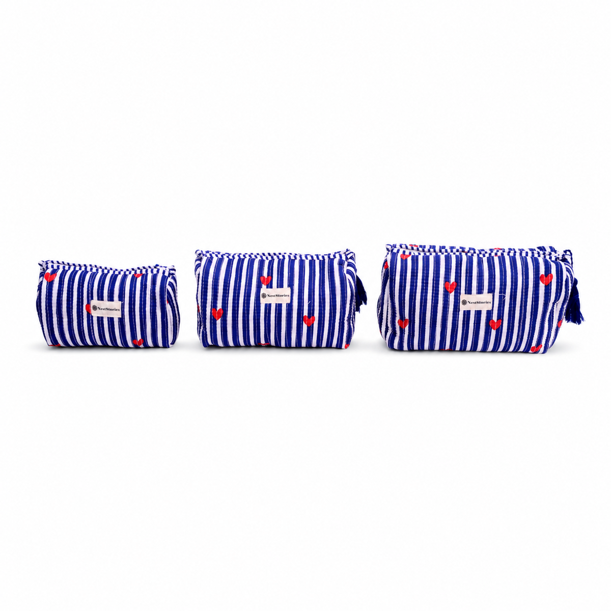 Three small zippered pouches in a matching blue and white striped fabric with small red hearts, arranged by size on a white background.