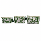 Three small zip pouches in a matching green and white floral pattern, arranged in ascending size order against a plain white background.