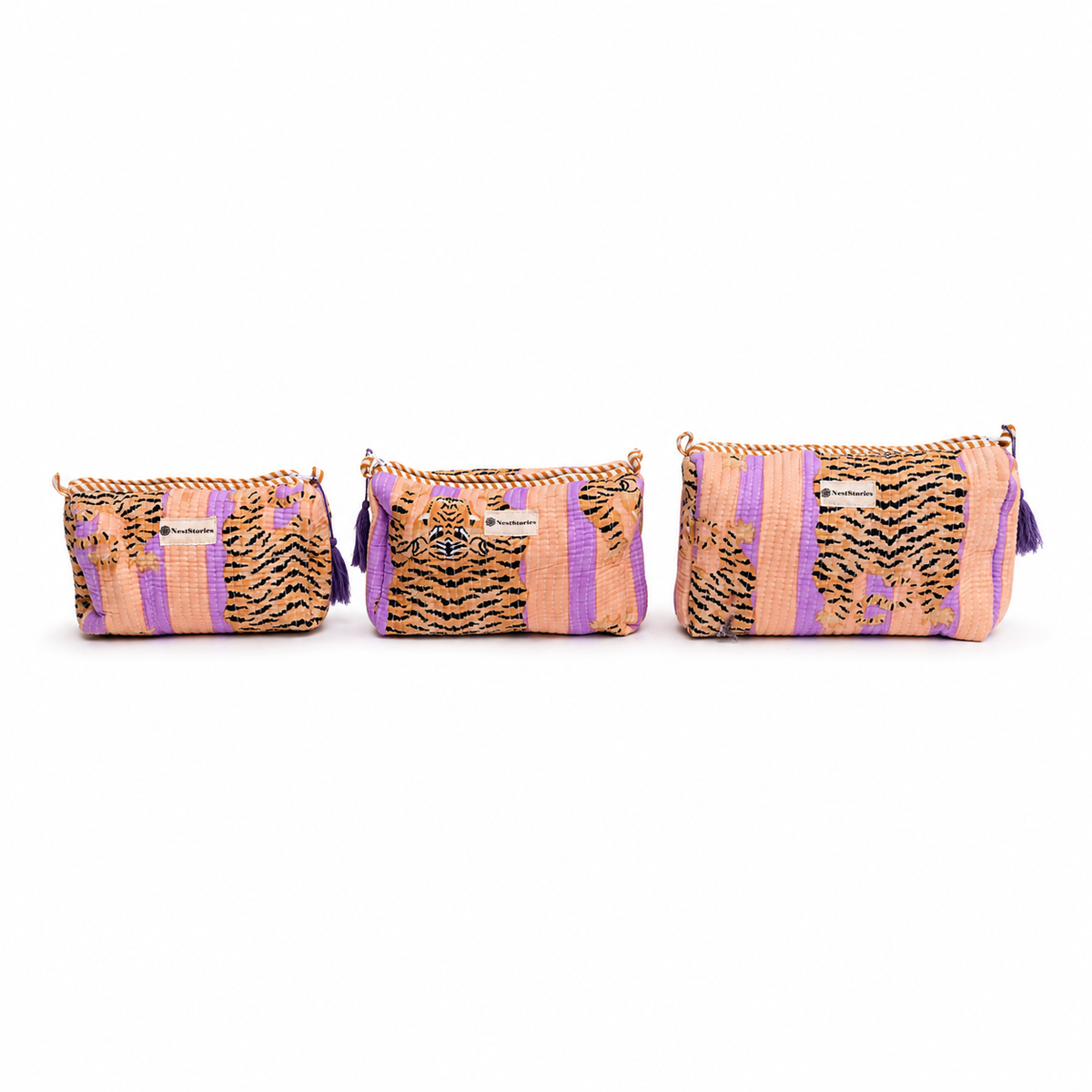 Three woven zippered pouches in matching sizes, featuring a pattern of purple stripes, tiger print, and floral motifs in orange, black, and purple, displayed on a white background.