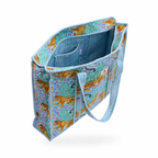 A tote bag with a blue and purple leopard print exterior and a striped blue interior, shown on a white background.
