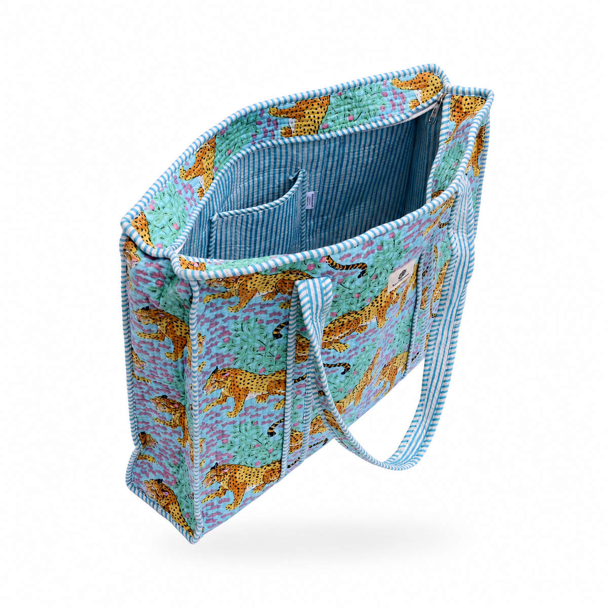 A tote bag with a blue and purple leopard print exterior and a striped blue interior, shown on a white background.
