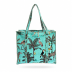 A turquoise tote bag with a tropical print featuring palm trees, toucans, zebras, and birds, finished with black and turquoise braided handles and trim, shown on a white background.