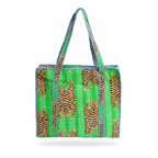 A woven tote bag featuring a bright green background with vertical tiger prints in brown and black, accented by blue and white braided trim and handles.